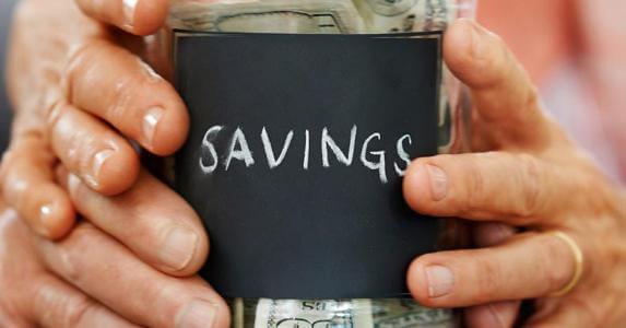 hands-of-couple-holding-savings-jar-together_573x300